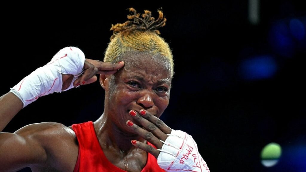 Boxeadora faz gesto para denunciar violência em
seu país